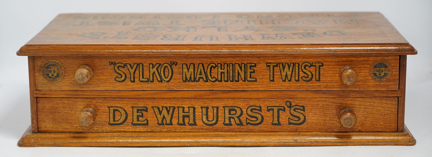 A mid 20th century Dewhurst's Sylko oak two drawer table top retail chest, 51cm wide, 14cm high. Condition - good